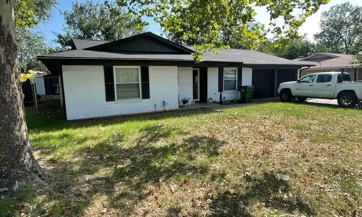 Professional roofing crew working on a residential roof in Phillipsburg